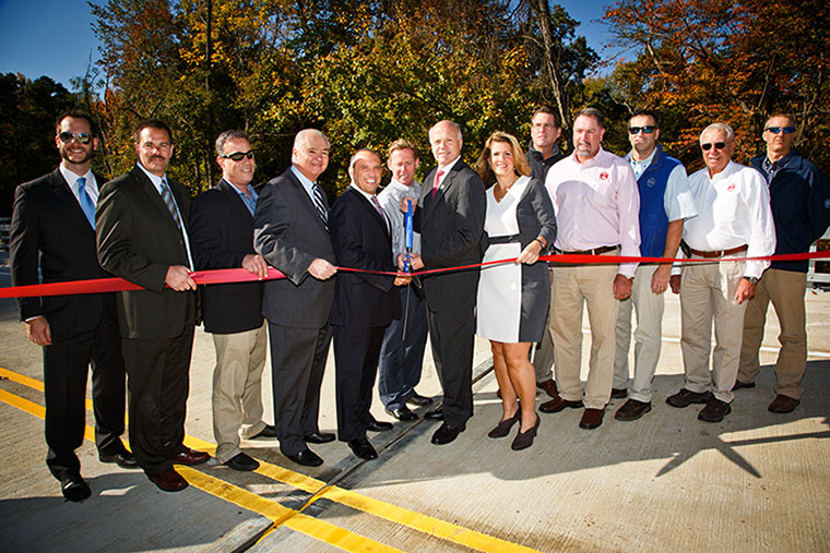 Pictured left to right: Howell Director of Community Development Jim Herman, County Public Works and Engineering Director John Tobia, Howell Deputy Mayor Rob Nicastro, Freeholder John Curley, Freeholder Thomas Arnone, Howell Mayor William Gotto, Freeholder Director Gary Rich, Sr., Freeholder Deputy, COO & President Tom Hardell, Rob Harms, Chief Exec. Officer, Dan Healey, Vice President of Engineering, George Harms, Chairman of the Board and Chris Carter, Senior Project Engineer. 
